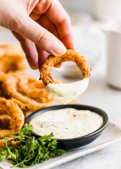 Onion ring with dip on it.