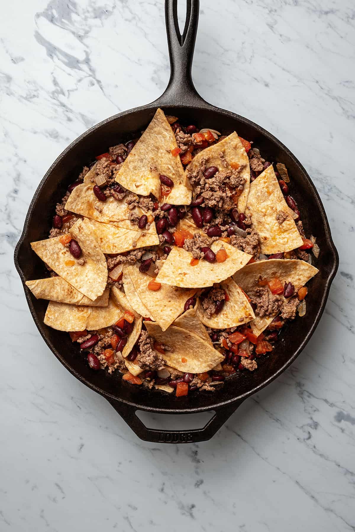 A skillet of burrito ingredients.