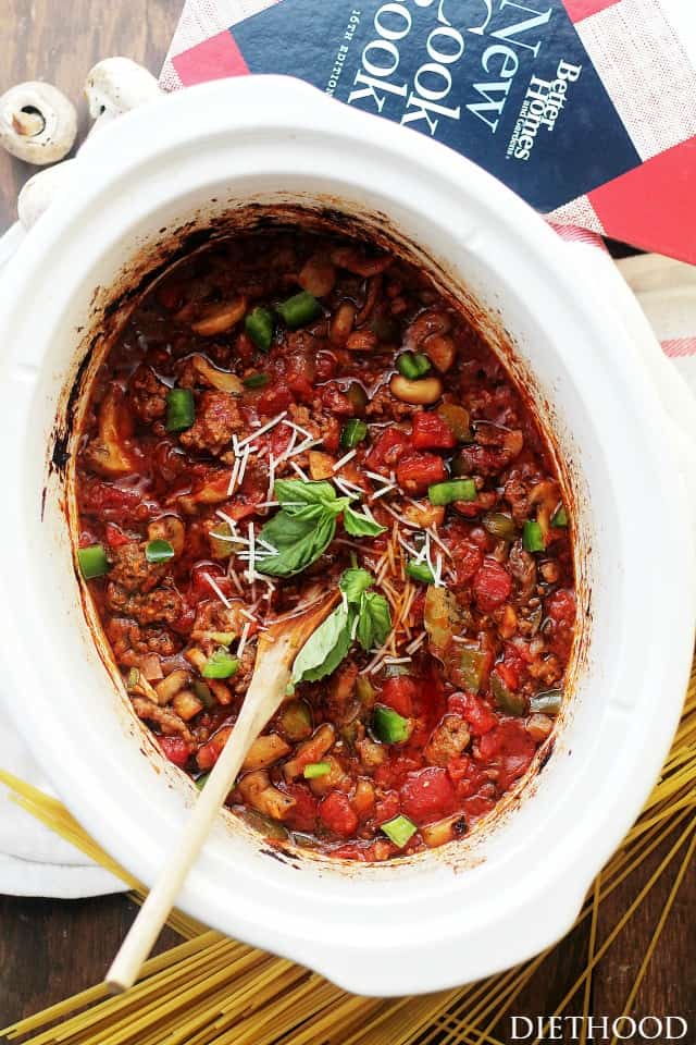 Overhead shot of a slow cooker insert filled with spaghetti meat sauce.