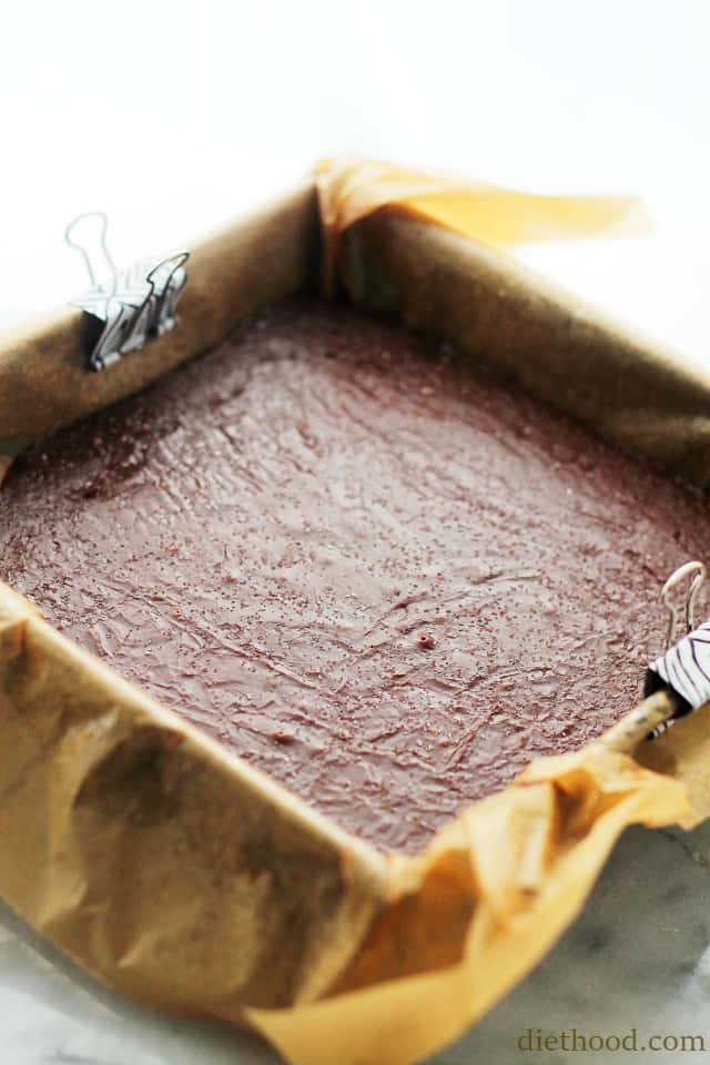 Setting chocolate fudge in a square pan.