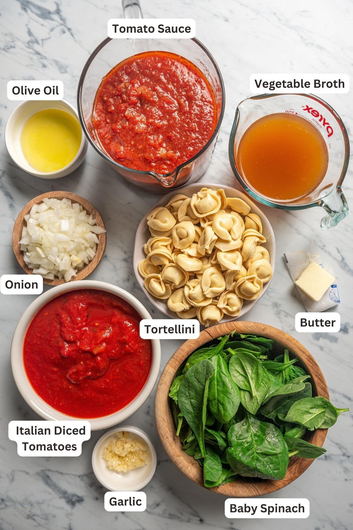 Ingredients for spinach tortellini tomato soup. 