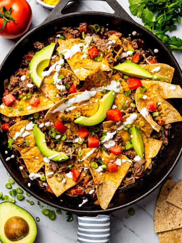 Burrito skillet recipe with ground beef, avocados, sour cream, and tomato.