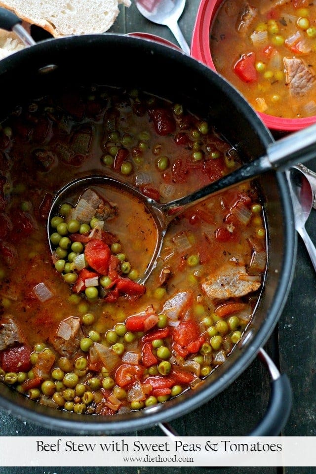 Beef Stew with Sweet Peas and Tomatoes in a pot.