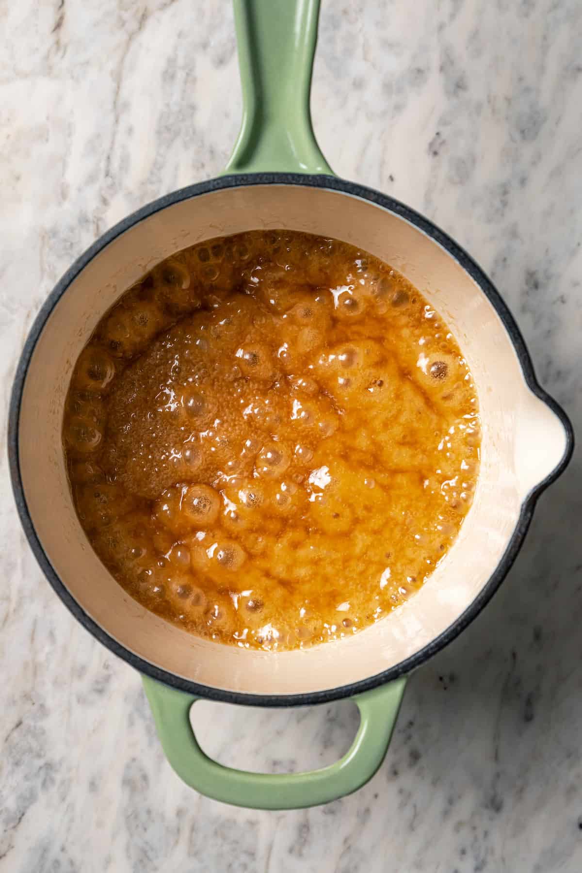 Caramel boiling in a saucepan.