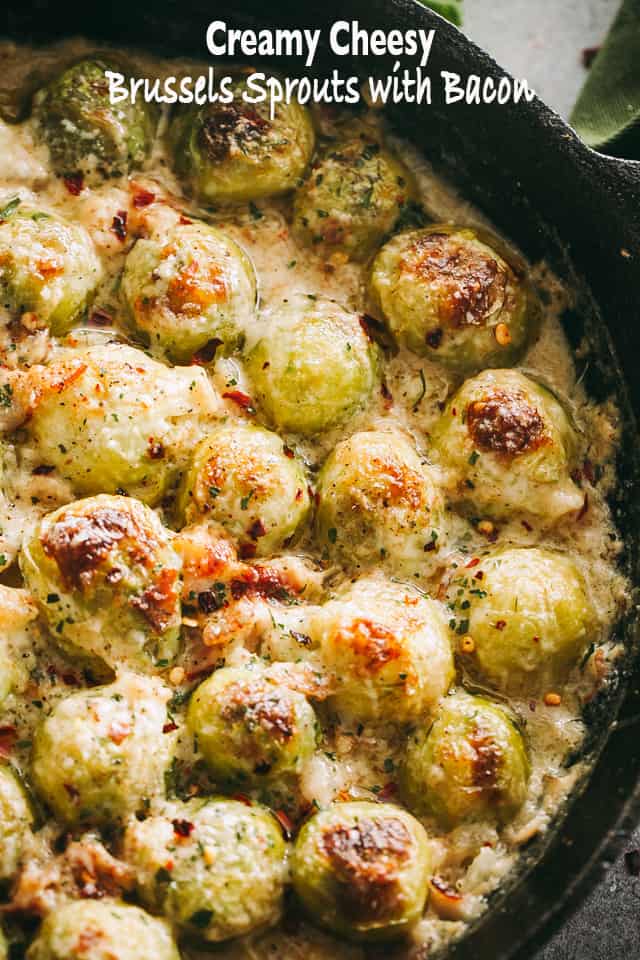 These Cheesy Brussels Sprouts with Bacon are roasted to perfection and dressed to impress in a delicious, garlicky parmesan cream sauce. Cheesy Brussels Sprouts with Bacon title card featuring a close up of roasted Brussels sprouts covered in cheese sauce.