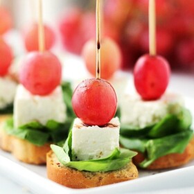 Macedonian-Style Grape Caprese Salad | www.diethood.com | This light, fresh appetizer-salad is made with red grapes, feta and spinach set atop slices of garlic toast.