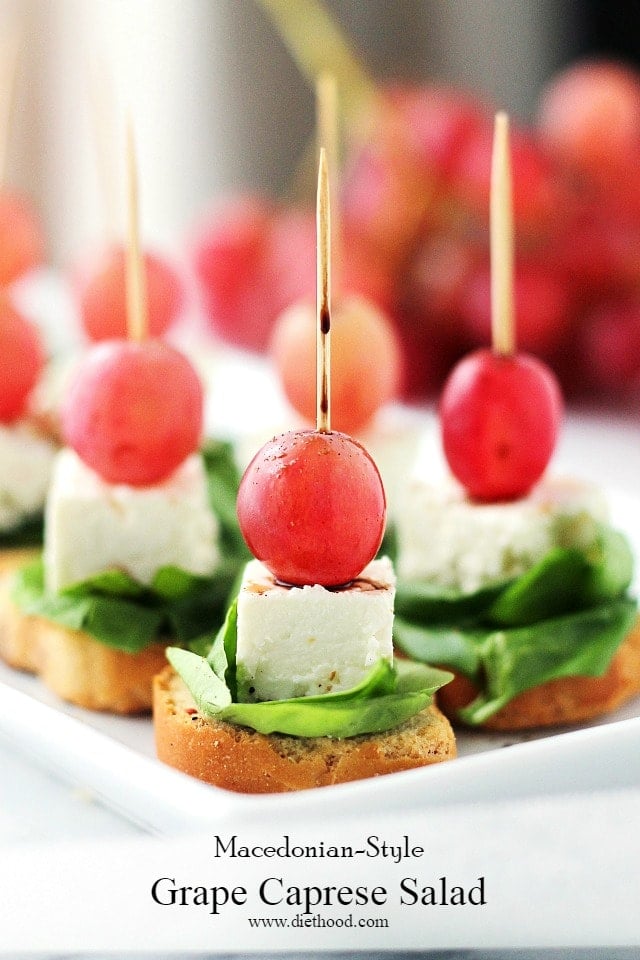 Macedonian-Style Grape Caprese Salad | www.diethood.com | This light, fresh appetizer-salad is made with red grapes, feta and spinach set atop slices of garlic toast. 