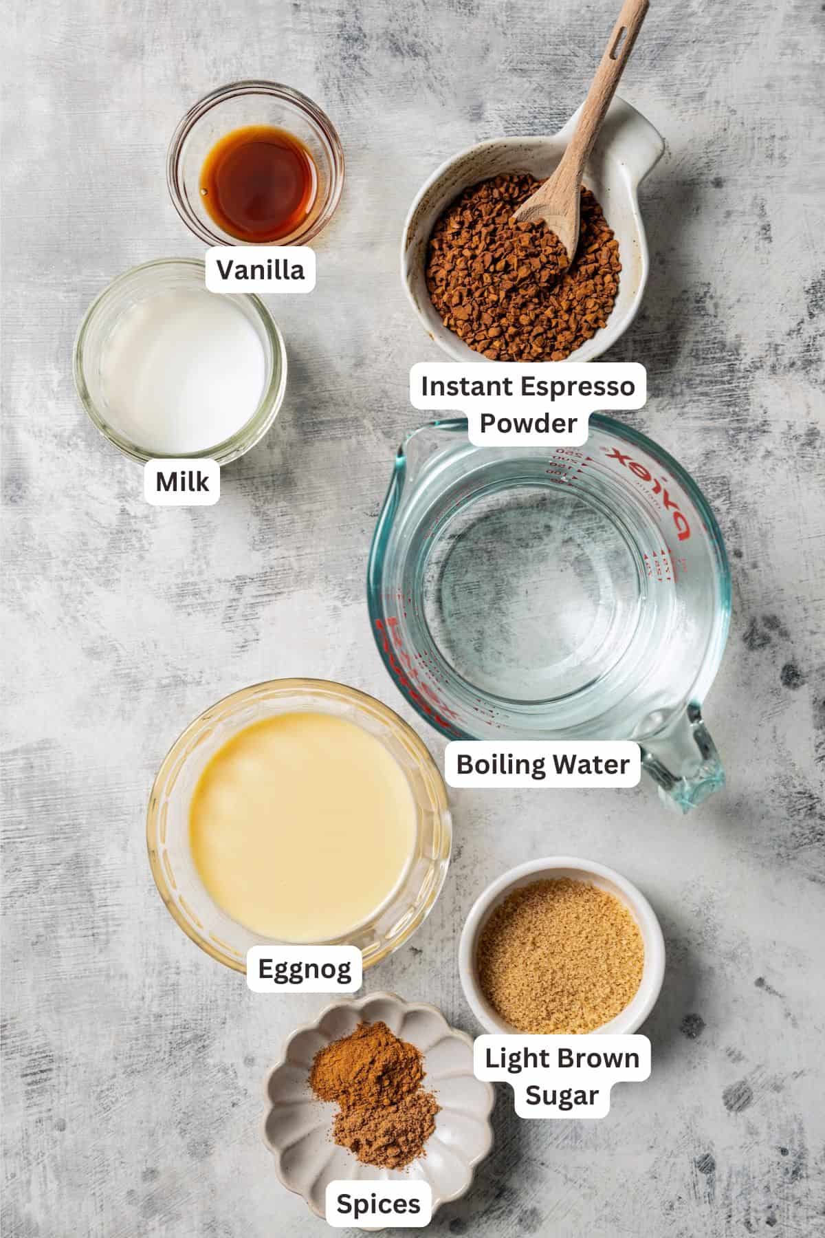 Ingredients for a Starbucks eggnog latte with text labels overlaying each ingredient.