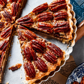 Overhead image of two slices of pecan pie.