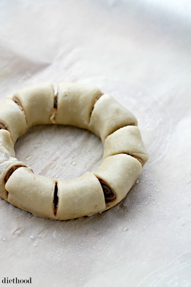 Cinnamon Roll Wreath | www.diethood.com | Festive, beautiful and delicious cinnamon roll shaped into a ring and decorated with a sweet vanilla glaze. 