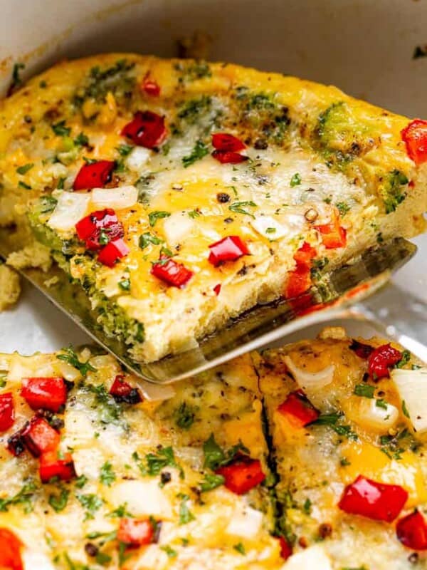 scooping up a piece of slow cooker omelette