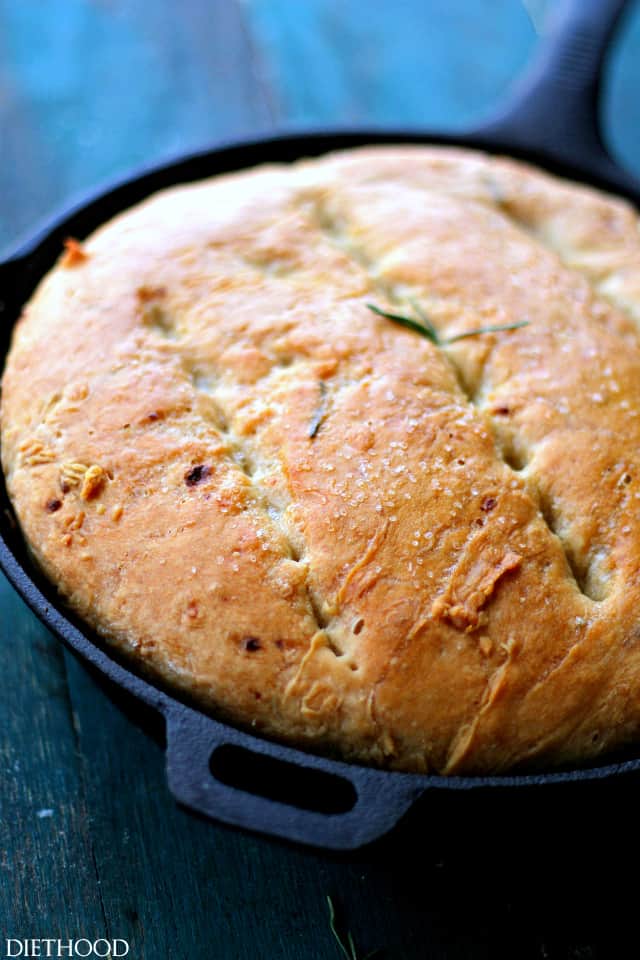 Overhead close-up photo of baked bread in a skillet.