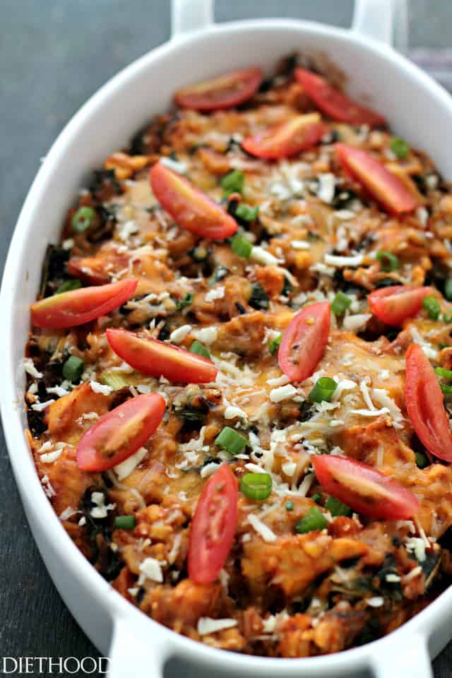 Chicken and wild rice casserole with kale, onions, cherry tomatoes, and melty cheese. 