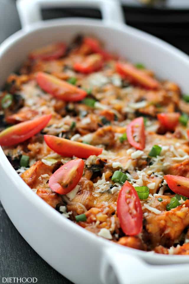 Chicken and wild rice casserole with cherry tomatoes on top. 