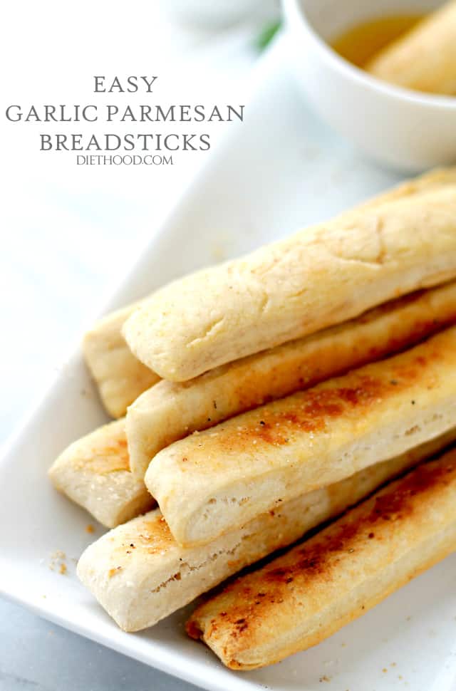 Easy Garlic Parmesan Breadsticks with Garlic Dipping Sauce | www.diethood.com | Sprinkled with Parmesan Cheese and dipped in a delicious Garlic Dipping sauce, these homemade breadsticks are not only easy to make, but they come together in just 30 minutes from start to finish! 