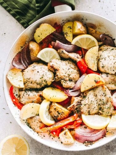 Chicken and veggies in the skillet with lemon-garlic marinade.