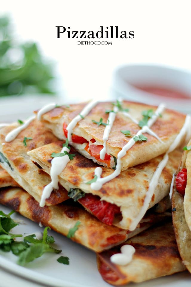 A serving plate with a stack of quesadillas.