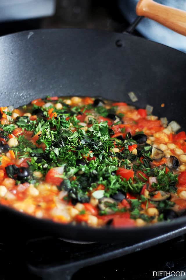 Cooking various diced vegetables in a wok.