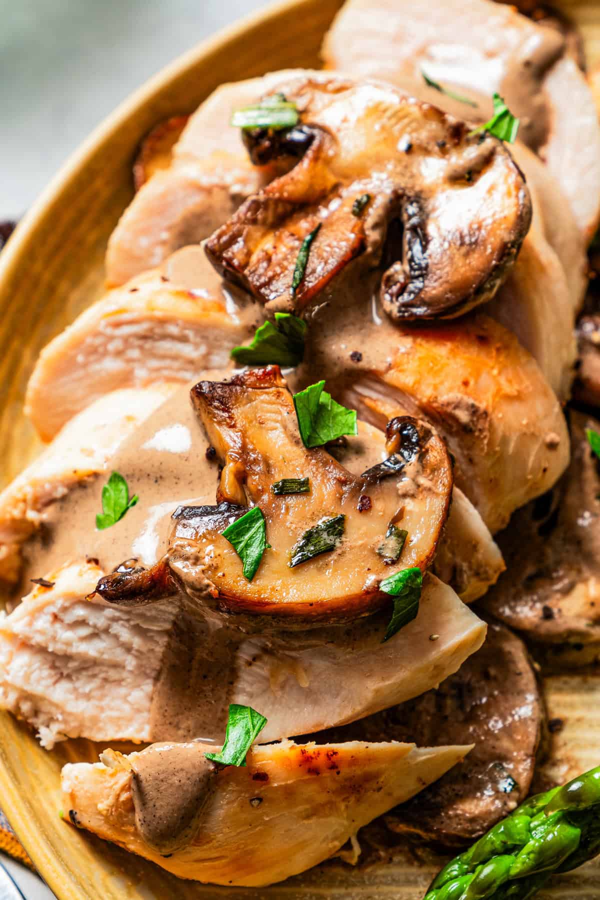 Cook and sliced chicken breast served topped with mushrooms and Dijon sauce.