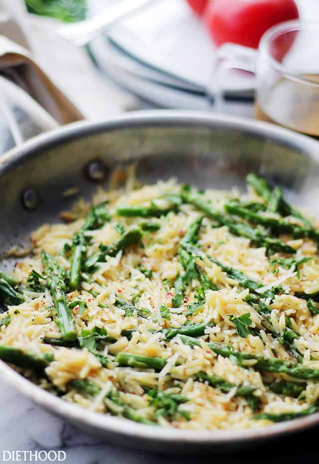 Tender orzo pasta with asparagus in a garlic butter sauce.