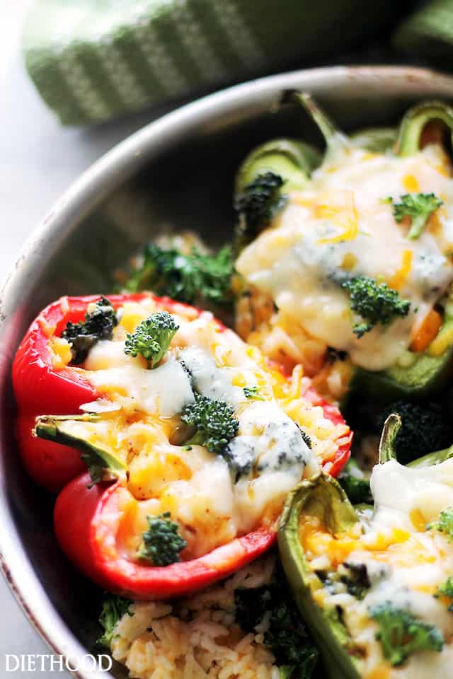 Broccoli and Cheese Stuffed Peppers - A delicious mixture of broccoli, cheese and rice stuffed inside colorful bell peppers. Get the recipe on diethood.com