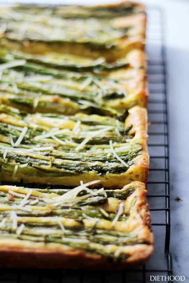 Asparagus on an egg-based crust topped with shredded cheese.