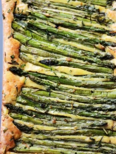 Stalks of asparagus baked into a cheesy frittata.