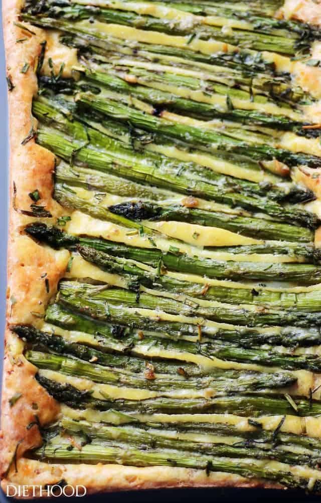 Asparagus on top of a cheesy crust.