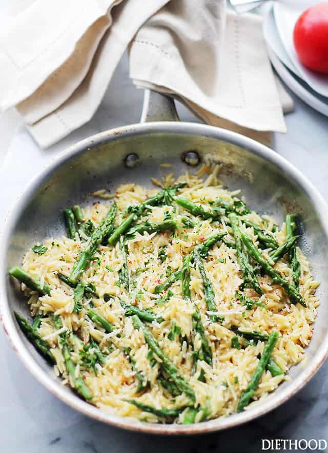 Orzo and asparagus with grated parmesan cheese.