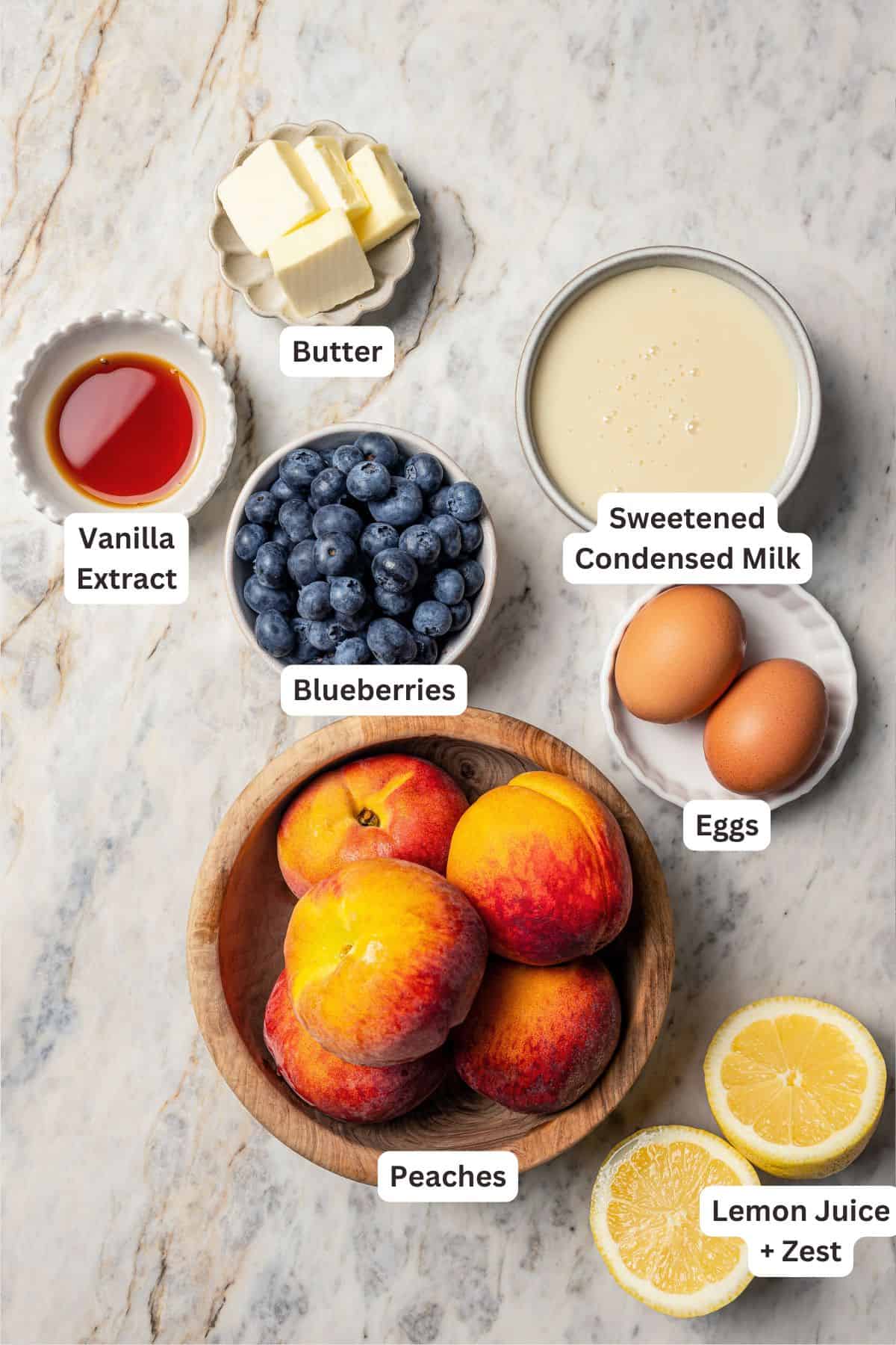 This peach blueberry pie is a fruit-filled custard pie bursting with juicy fresh peaches and blueberries, topped with a nutty pecan streusel. Peach blueberry pie ingredients with text labels overlaying each ingredient.
