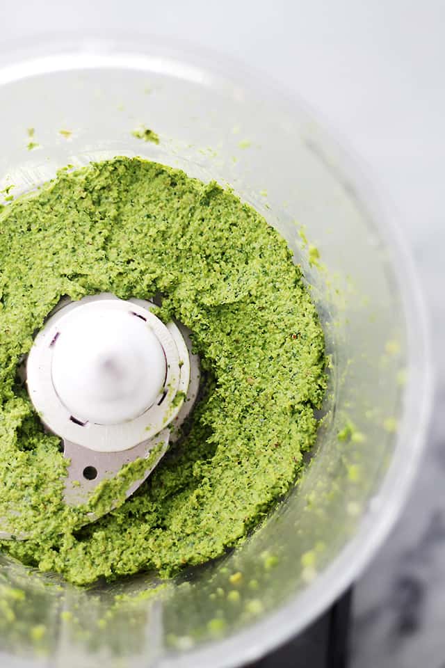 Spinach Pesto - Made with just a handful of everyday ingredients including fresh spinach and parmesan cheese, this healthy sauce goes great with pasta, chicken, veggies, and much more! Get the recipe on diethood.com