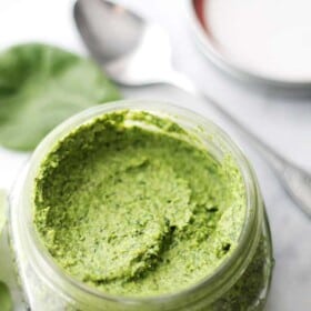 Spinach Pesto - Made with just a handful of everyday ingredients including fresh spinach and parmesan cheese, this healthy sauce goes great with pasta, chicken, veggies, and much more! Get the recipe on diethood.com