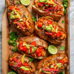 Loaded baked potatoes arranged on a serving tray.