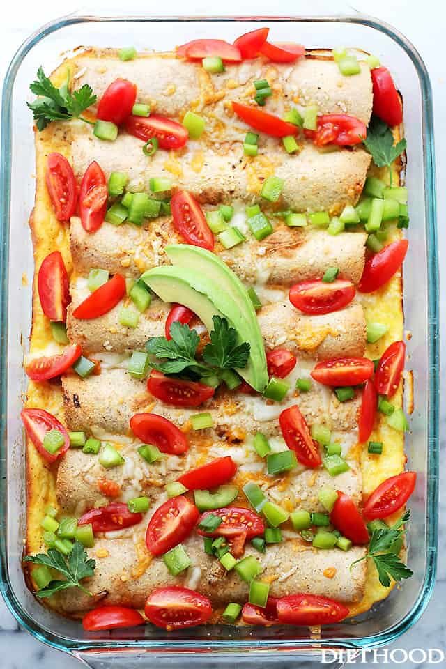 Overnight Breakfast Enchiladas - Flour Tortillas filled with turkey sausage, green onions, peppers and cheese, covered in a creamy egg batter and baked. A delicious breakfast casserole that can be prepped the night before and baked the next day! Get the recipe on diethood.com