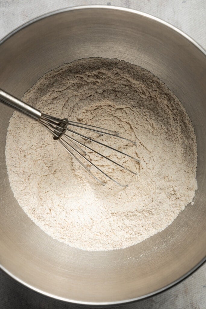 Whisking the dry ingredients in a bowl.