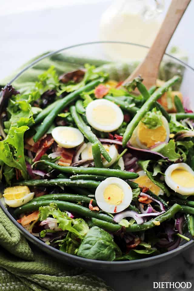 Green Bean and Egg Salad with Garlic Parmesan Vinaigrette - A simple salad of green beans, eggs and bacon tossed with an amazing Garlic Parmesan Vinaigrette. This is Spring in a salad bowl!  Get the recipe on diethood.com