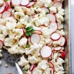 Garlic Parmesan Cauliflower Salad - Cauliflower florets tossed with sliced radishes, bacon, sunflower seeds, green onions and a Garlic Parmesan Salad Dressing that is SO incredibly good! Get the recipe on diethood.com
