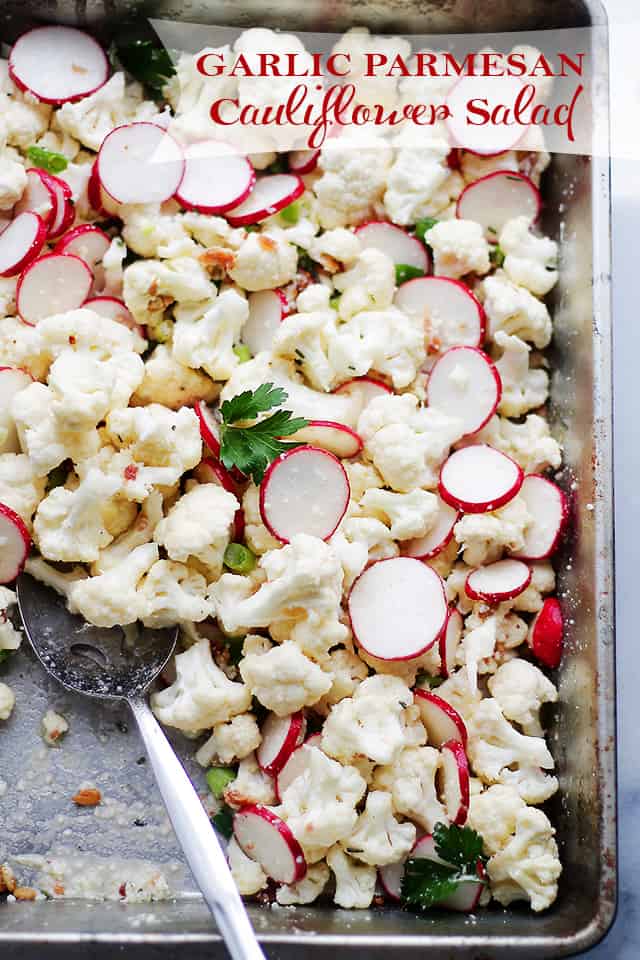 Garlic Parmesan Cauliflower Salad - Cauliflower florets tossed with sliced radishes, bacon, sunflower seeds, green onions and a Garlic Parmesan Salad Dressing that is SO incredibly good! Get the recipe on diethood.com