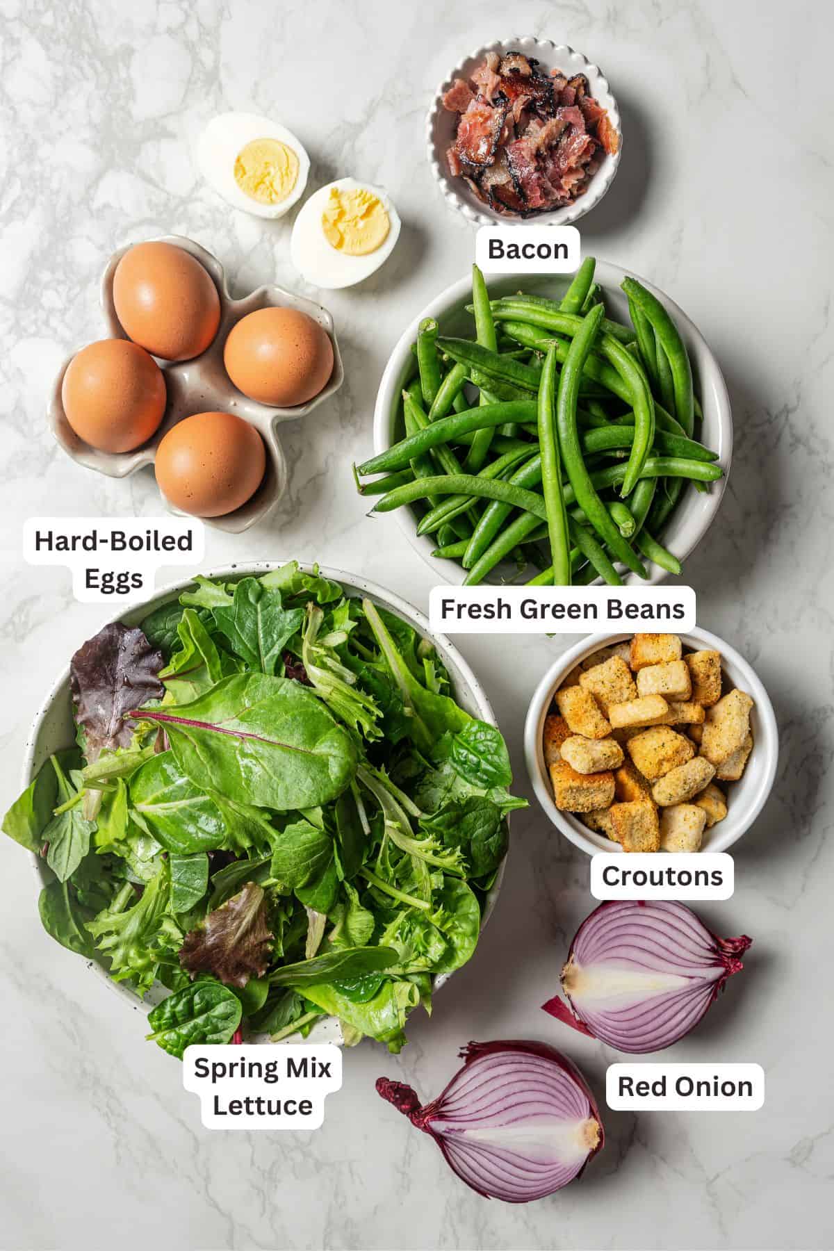 Green bean salad ingredients with text labels overlaying each ingredient.