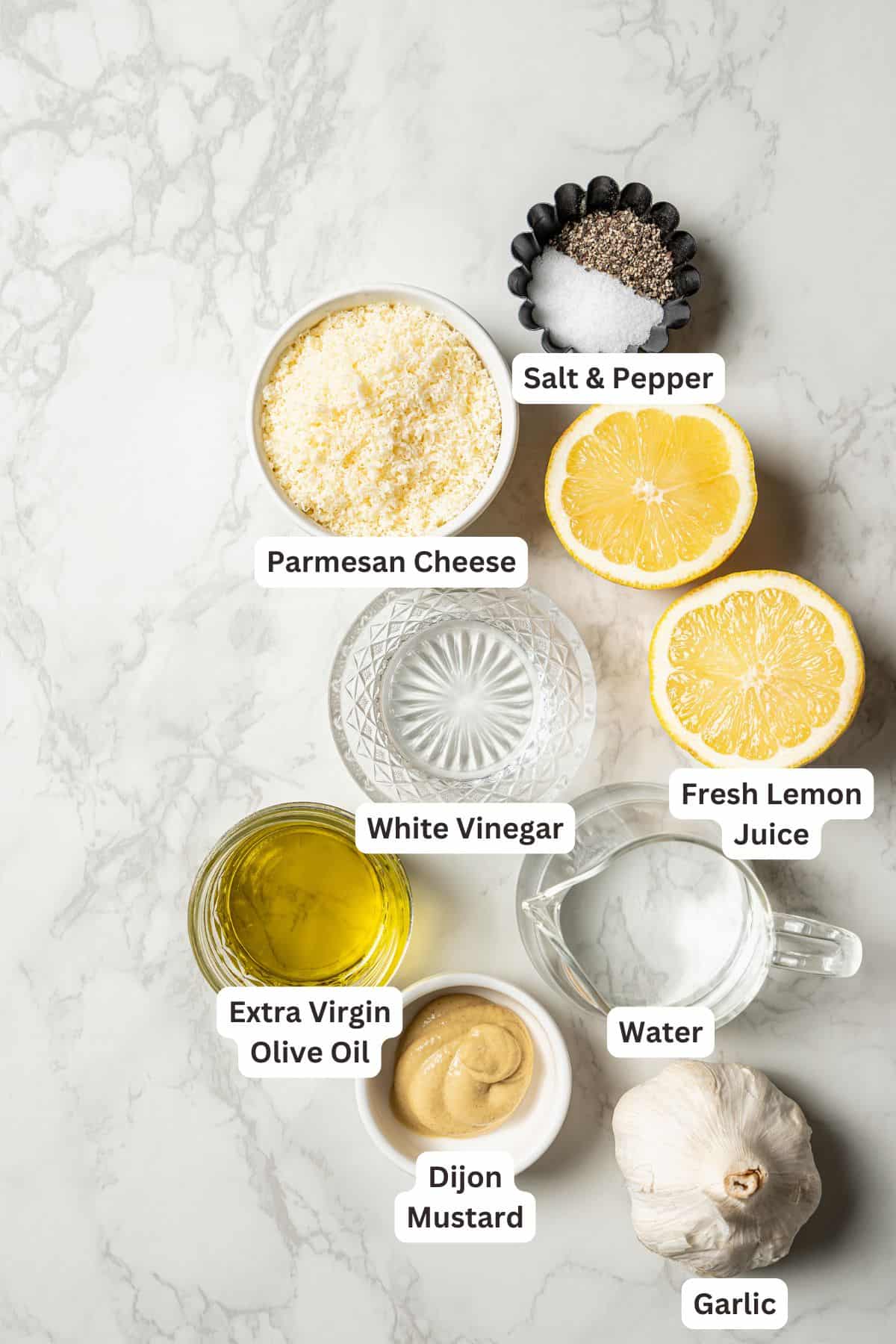 Garlic parmesan vinaigrette ingredients with text labels overlaying each ingredient.