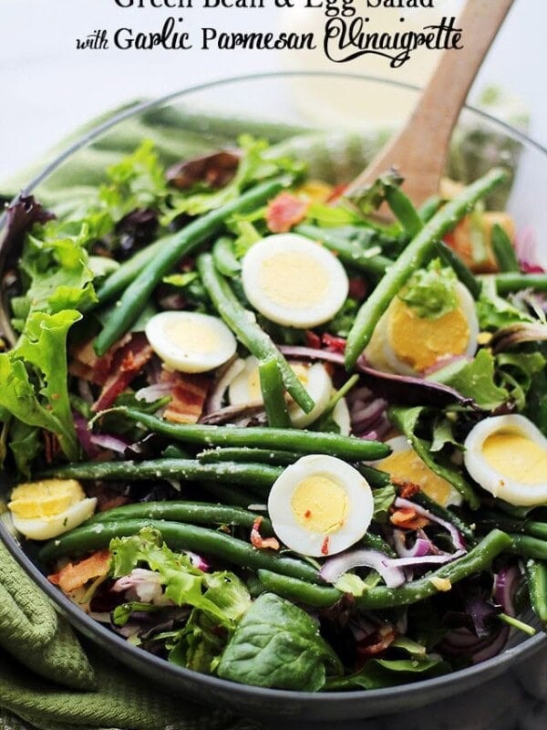 Green Bean and Egg Salad with Garlic Parmesan Vinaigrette - A simple salad of green beans, eggs and bacon tossed with an amazing Garlic Parmesan Vinaigrette. This is Spring in a salad bowl! Get the recipe on diethood.com