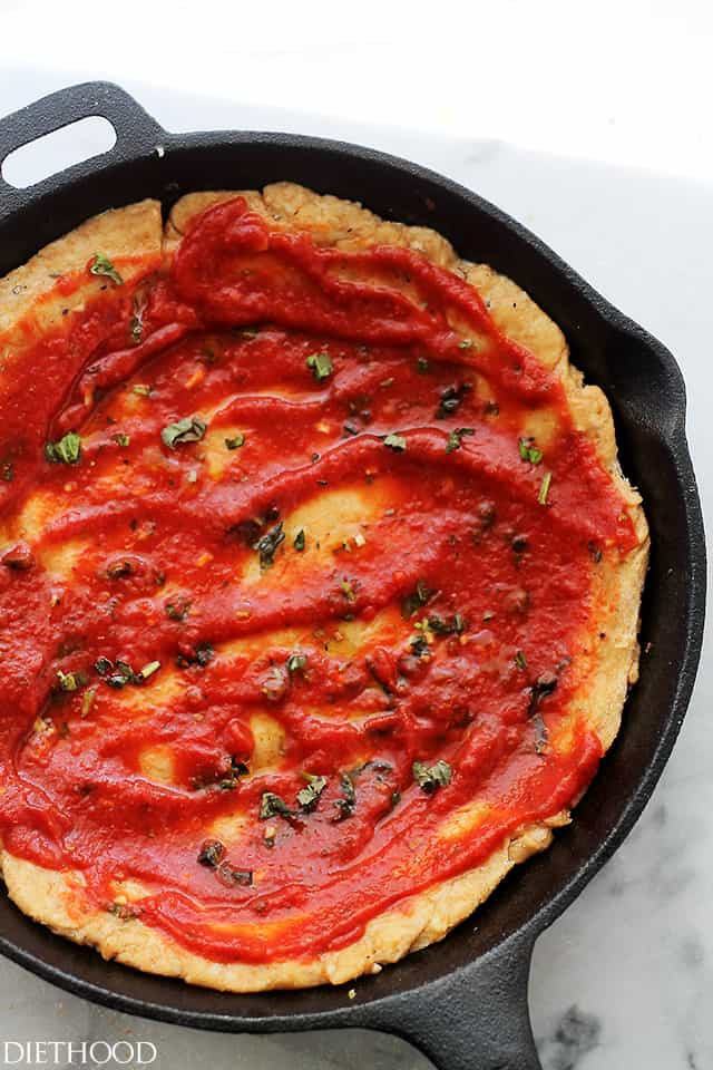 Whole Wheat Deep Dish Skillet Pizza - Soft, flavorful, homemade, MILE-HIGH Whole Wheat Pizza Dough topped with tomatoes, delicious herbs and lotsa cheese! Get the recipe on diethood.com