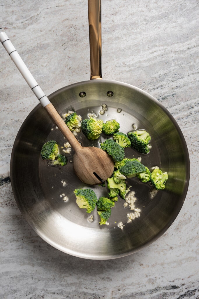 Cooking the broccoli and garlic. 