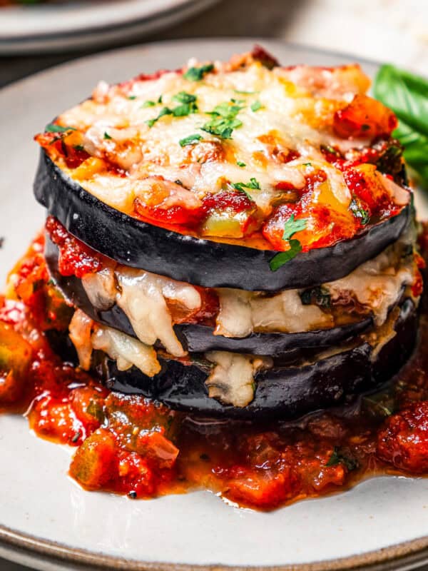 Roasted eggplant stacks served on a plate.