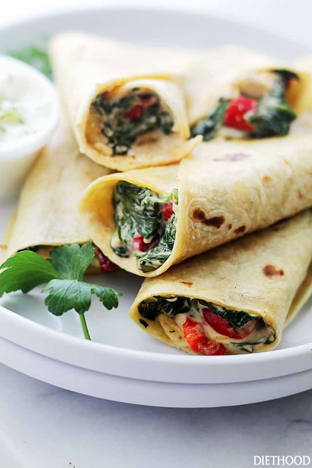 Creamy Spinach and Feta Cheese Tortilla Wraps - A deliciously creamy mixture of cheeses, peppers, spinach and feta wrapped in a flour tortilla. Get the recipe on diethood.com