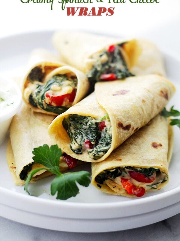 A pile of Creamy Spinach and Feta Cheese Tortilla Wraps served on a plate.