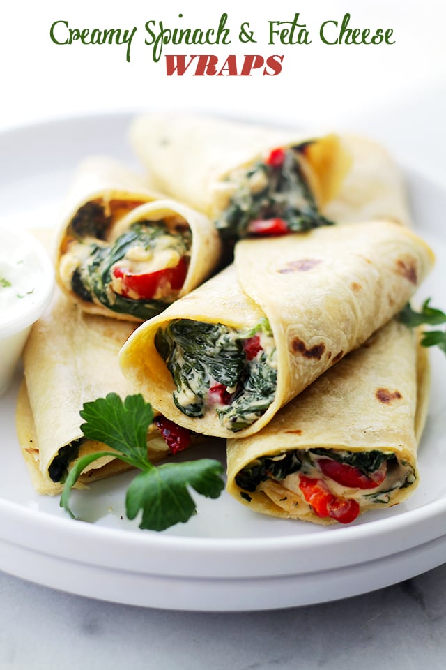 A pile of Creamy Spinach and Feta Cheese Tortilla Wraps served on a plate.