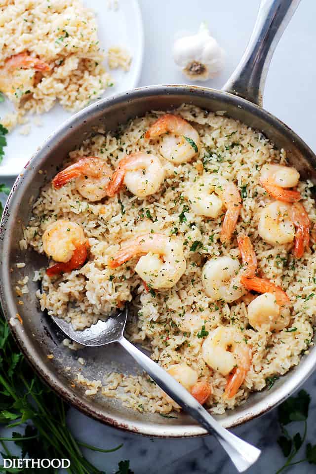 Overhead shot of a skillet with prepared Garlic Butter Shrimp and Rice.