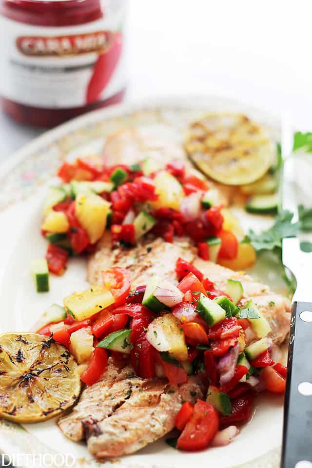 Grilled Salmon with Pineapple & Piquillo Peppers Salsa - A quick, fresh and extremely flavorful Pineapple & Piquillo Peppers Salsa served alongside grilled Salmon. Get the recipe on diethood.com