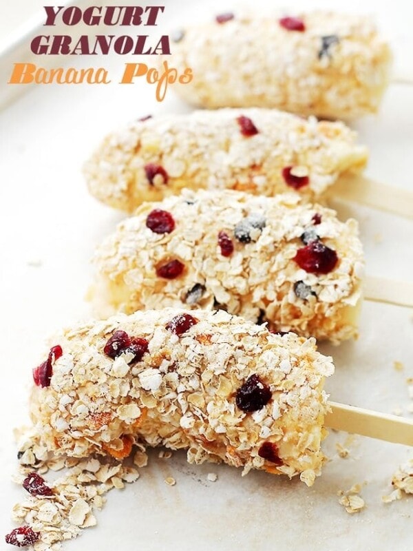 Yogurt Granola Banana Pops - Frozen bananas dipped in fruit-yogurt and covered in granola. One of the best snacks, evah! AND, you might even believe that you're eating ice cream! Get the recipe on diethood.com